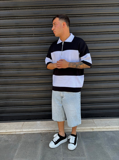 Polo a righe con zip bianca e nera